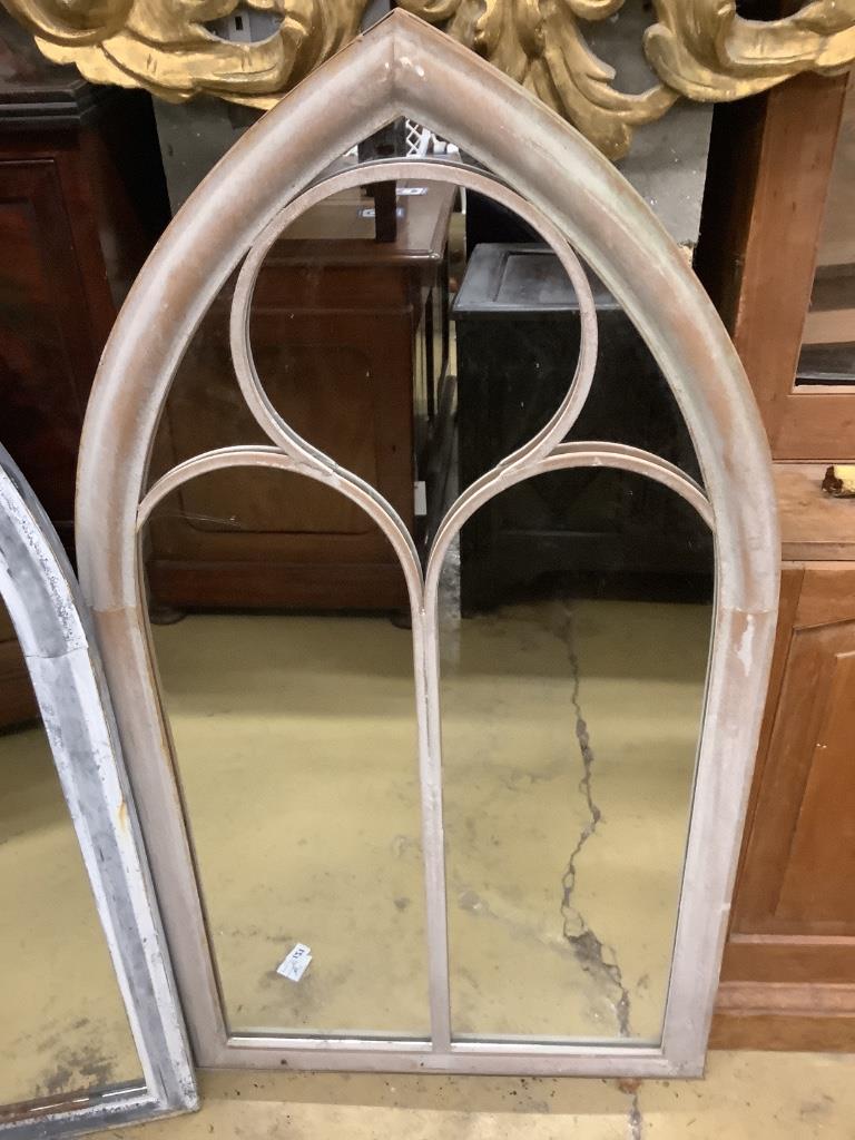 A pair of metal framed lancet arched wall mirrors, width 60cm height 110cm